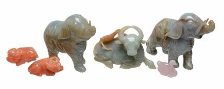 A large group of nine Chinese hardstone animals and rocks, and a variety of small wood stand, of