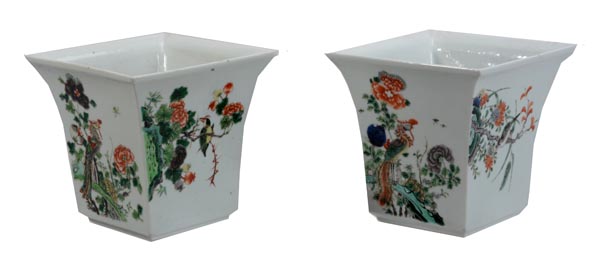 A pair of famille vert cachepot, each of tapered square section and resting on a short foot,