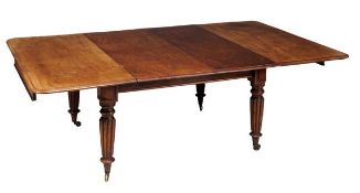 A William IV mahogany dining table, circa 1835, with a moulded top with four additional leaf