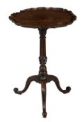 A George III mahogany tilt top occasional table, circa 1770, with piecrust top above fluted stem,