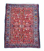 A Persian carpet, approximately 204cm x 128