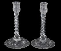 A pair of facet-stemmed candlesticks, with domed bases, 24cm high