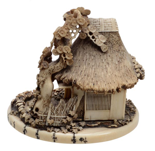 A Japanese ivory carving of a rustic tea house surrounded by pine trees, signed to the base, late - Image 2 of 2