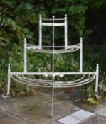A Victorian white painted wrought iron conservatory plant stand, last quarter 19th century, of