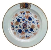 A Chinese armorial Export charger decorated with underglaze blue, gilded and red designs of