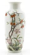 A Chinese famille rose vase decorated with pomegranates and floral shrubs, accompanied by a lengthy