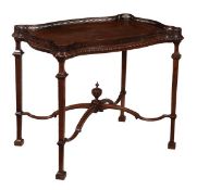 A George III mahogany silver table, circa 1800, the serpentine shaped top with pierced gallery and