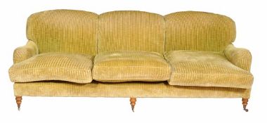 An upholstered three seater sofa, late 20th century, in the manner of Howard & Sons possibly by