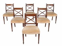 A set of six late George III mahogany dining chairs, circa 1800, each with string inlaid bars and