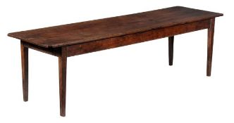 A walnut refectory table 19th century and later the plank top above a moulded frieze on square