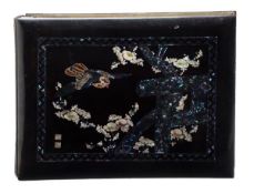 A Japanese photographic album with black lacquered cover inlaid with ivory designs of birds and