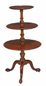A George III mahogany three tier dumb waiter, circa 1780, the circular tiers divided by a turned