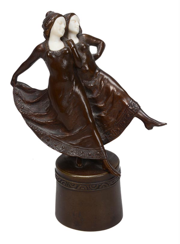 Peter Tereszczuk (1875-1963), a bronze and ivory figure of two girls dancing, dark brown