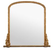 A Victorian giltwood and composition wall mirror, circa 1870, the arched plate within a moulded