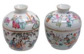 Two Chinese famille rose jars and covers decorated with court figures amid a garden setting and a