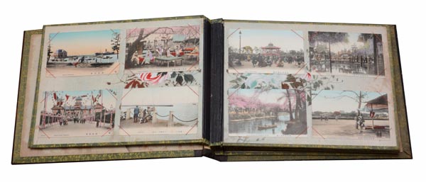 A Japanese photographic album with black lacquered cover inlaid with ivory designs of birds and - Image 2 of 2