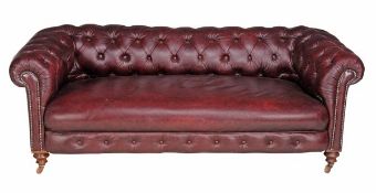 A Victorian leather upholstered Chesterfield sofa, second half 19th century, the burgundy red
