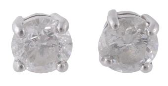 A pair of diamond single stone ear studs, the brilliant cut diamonds, weighing 1.10carats and 1.02