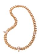 A late Victorian gold and half pearl necklace, circa 1890, the rectangular panels with beaded
