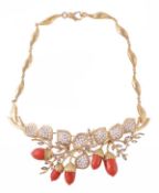 A coral and diamond acorn necklace, the coral acorns (Coralliun Rubrum) with textured caps, the