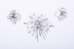 A diamond snowflake brooch and pair of earrings, the brooch centrally set with a cluster of old