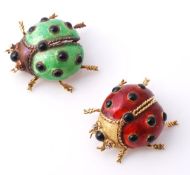 Two enamel ladybird brooches, the first with red enamel wings and black enamel spots, the eyes set