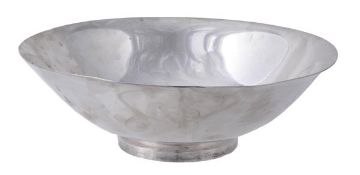 An American silver coloured bowl by Gorham Manufacturing Co., plain with a flared rim, on a plain