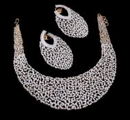 A diamond necklace and ear pendents suite, the articulated graduated bib set with baguette and