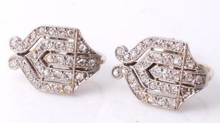 A pair of Art Deco diamond ear clips, each designed as a pierced geometric stylised ogee panel