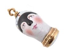 A Bilston enamel head-form pendant, circa 1770, modelled as a lady in a mask, the base with