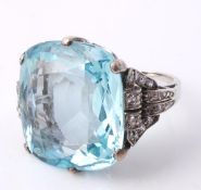 An aquamarine and diamond ring, the rectangular, cushion cut aquamarine, approximately 20.00