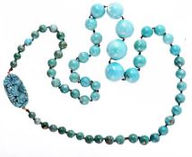 A graduated turquoise bead necklace, the fifty eight 7.7mm to 21.8mm polished turquoise beads on a