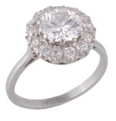 A diamond cluster ring, the central brilliant cut diamond, weighing 1.66 carats, in a claw setting,