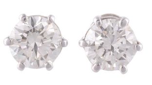 A pair of diamond single stone ear studs, the brilliant cut diamonds, weighing 1.26 carats and 1.24