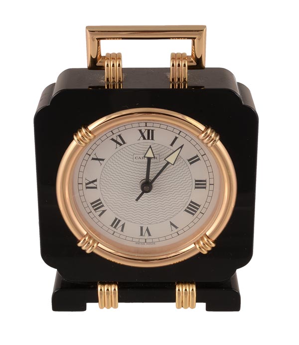 Cartier, an onyx and gilt quartz alarm clock, circa 1990, no. 901700999, the shaped square onyx