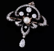 An early 20th century diamond and pearl pendant/brooch, circa 1900, the central pearl with in an