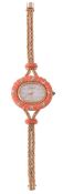 DeLaneau, a lady`s 18 carat gold, coral and diamond wristwatch, the two piece case with a carved