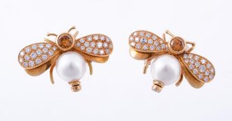 A pair of yellow diamond and diamond insect ear clips by Scortecci, each with brilliant cut yellow