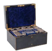 A Victorian ebony travelling toilet case with silver mounted fittings by James Beebe, London 1872,