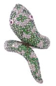 A tsavorite garnet and diamond serpent ring, the serpent`s head and tail set throughout with