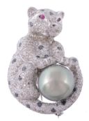 A South Sea cultured pearl and diamond panther brooch by Currado, the seated panther set throughout