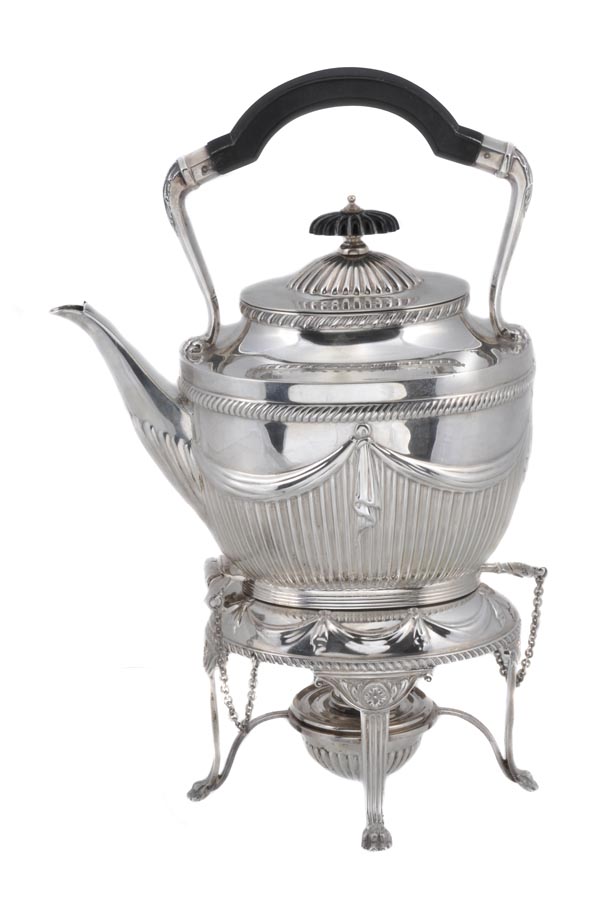 A late Victorian silver tea kettle on stand by The Goldsmiths & Silversmiths Co. Ltd. (William