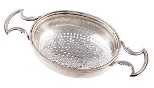 A George III silver oval orange or lemon strainer by Peter & Ann Bateman, London 1793, with a