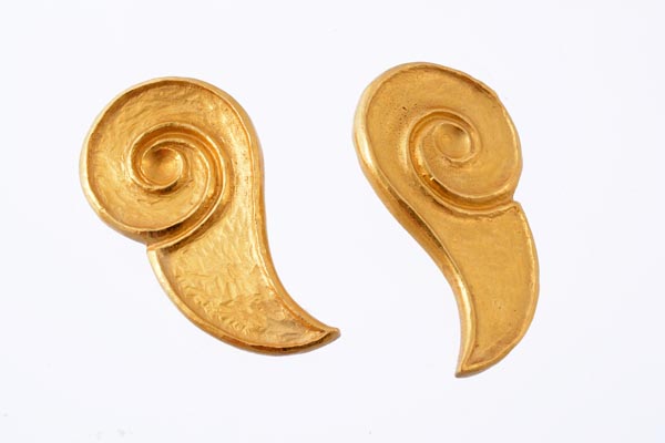A pair of ear clips by Lalaounis, of voluted tear shape form, with textured detail and a hammered