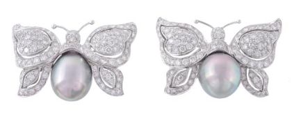 A pair of South Sea cultured pearl and diamond butterfly brooches, the 12mm South Sea cultured
