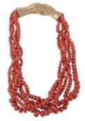 An 18 carat gold and coral necklace by David A. Thomas, the slightly compressed coral beads