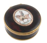 A late 18th century circular snuff or bonbonniere box mounted with a miniature equestrian portrait