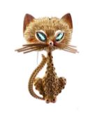 An 18 carat gold cat brooch by Garrard & Co., the multi textured head, body and tail, with marquise