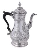 An early George III silver baluster coffee pot by William Cripps, London 1761, with an acorn finial