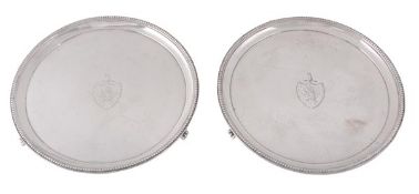 A pair of George III silver circular waiters by Elizabeth Jones, London 1786, each engraved with an